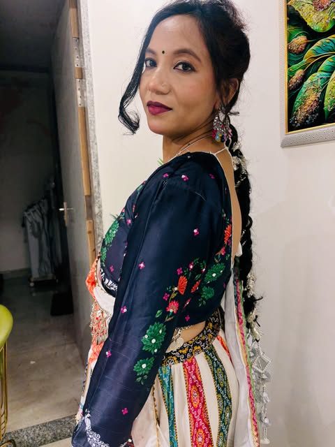 Braided hairstyle with navy embroidered blouse