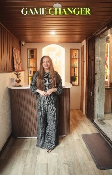 Shine On reception desk with warm wood panelling