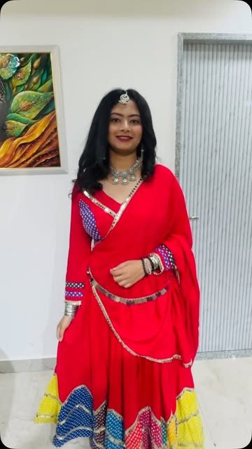 Client in red lehenga with traditional makeup and jewellery